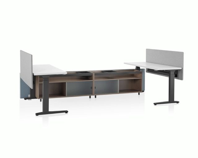 Modular office desk with privacy panels, black legs, and wood storage cabinets
