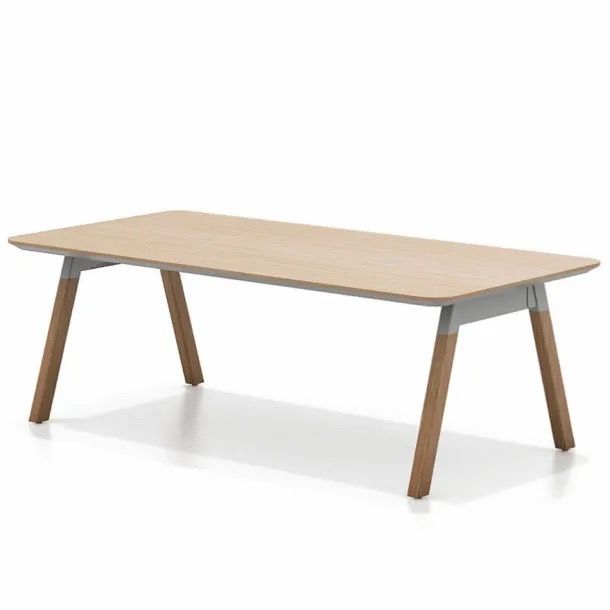 Light wood rectangular table with angled wooden legs on a white background