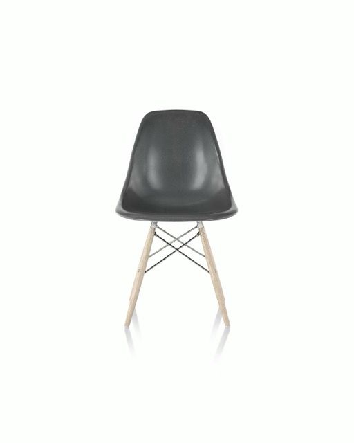 Black molded chair with wooden legs on a white background