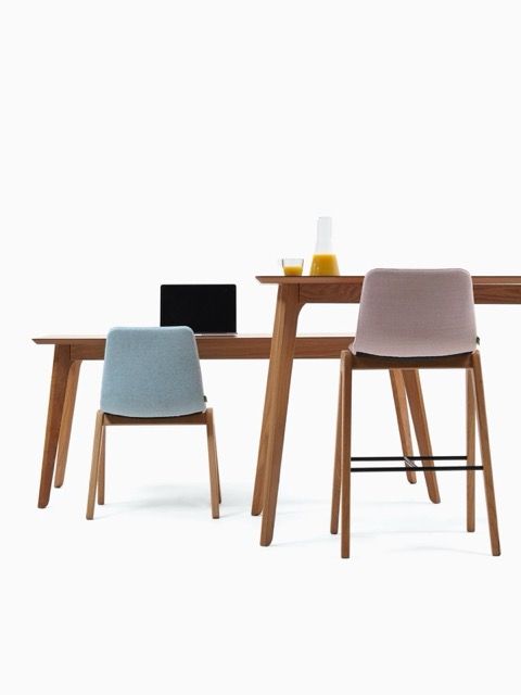 Modern wooden desk and dining chair set with a laptop and cup on a white background