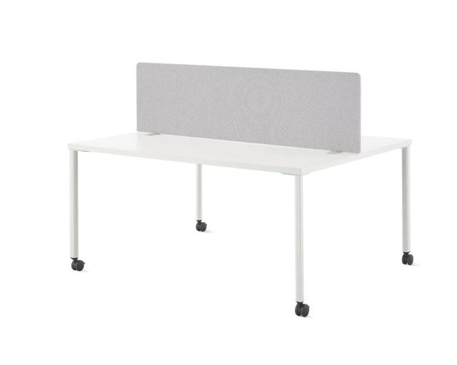 White office desk with black legs and gray privacy panel divider