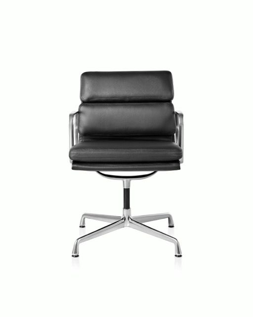Black leather swivel office chair with chrome base on a white background