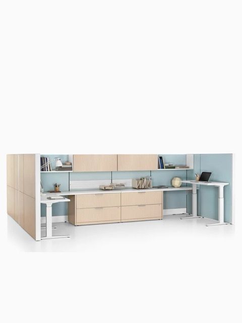 Modern minimalist office with light wood cabinets, pale blue shelves, and white desks on a white background