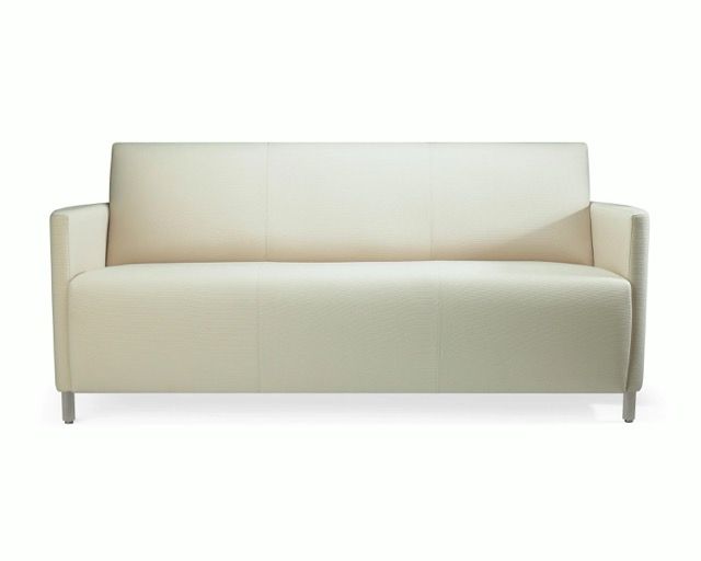 Cream-colored modern sofa with low arms and metal legs on a white background
