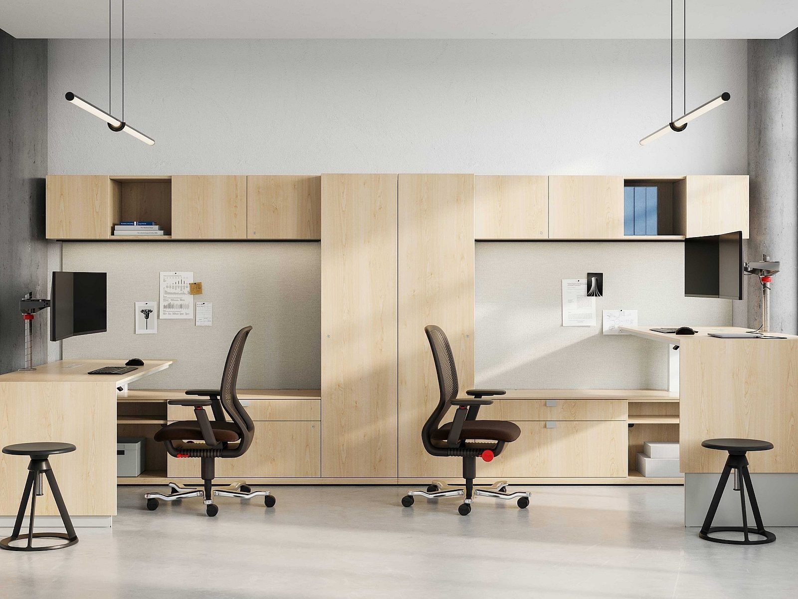 Modern shared office with two desks, chairs, and light wood storage cabinets