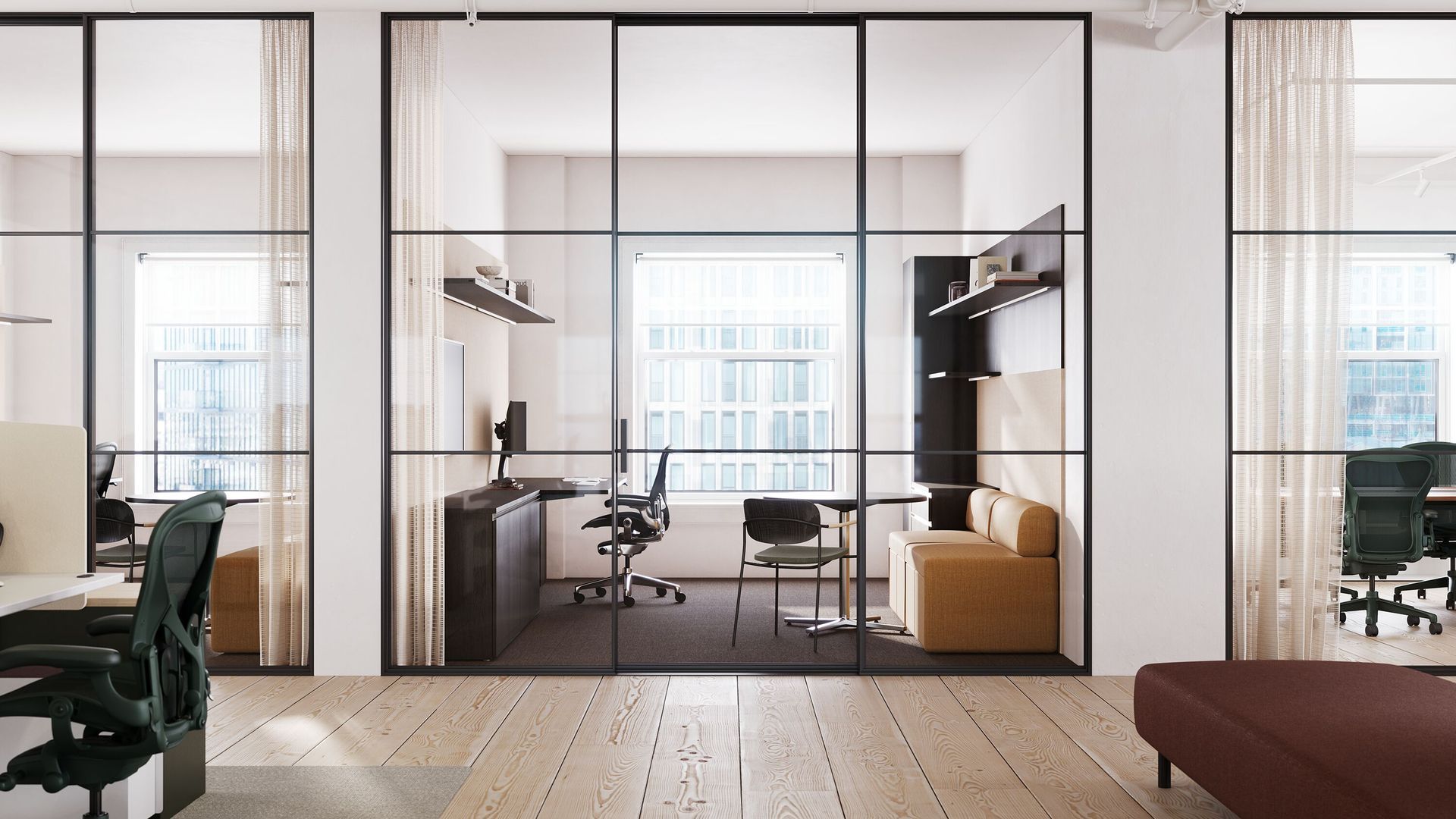 Modern office interior with glass-walled meeting room, desks, chairs, shelves, and a sofa