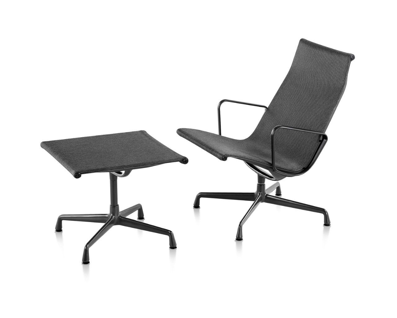 Black lounge chair with matching black side table on a white background