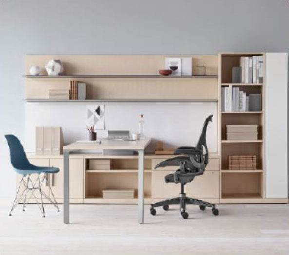 Minimal home office with wooden desk, shelving, blue chair, and black office chair