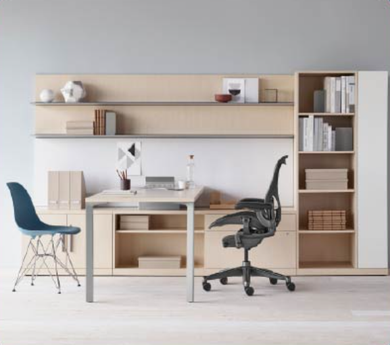 Minimal home office with wooden desk, shelving, blue chair, and black office chair