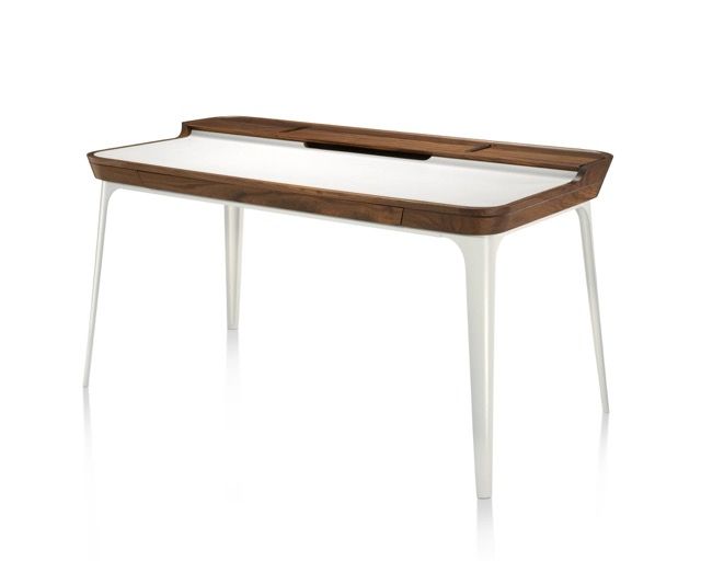Modern white desk with slim white legs and a wood tabletop organizer.