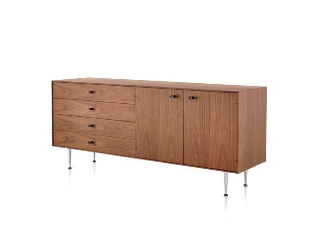 Mid-century wooden sideboard with drawers, cabinet doors, and metal legs on a white background