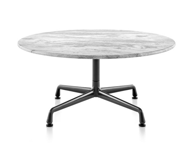 Round white marble table with a black pedestal base on a white background