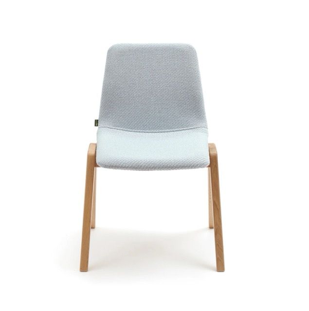 Modern gray upholstered chair with light wood legs on a white background