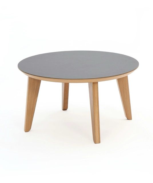 Round gray tabletop on four light wood legs, isolated on white background