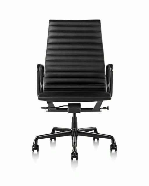 Black ribbed office chair with armrests and five-star wheeled base on a white background