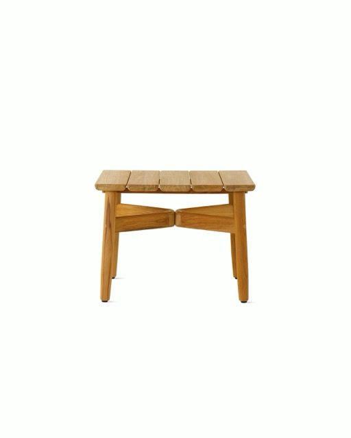 Small wooden stool with a light wood top and tapered legs on a white background