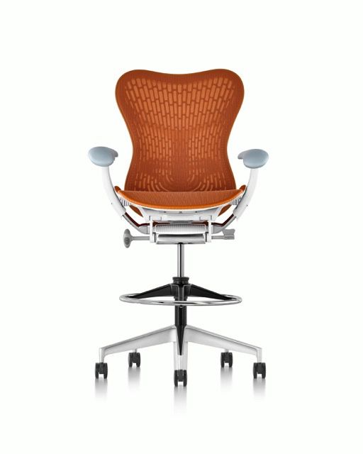 Orange ergonomic office chair with silver frame, armrests, and five-star wheeled base on white background