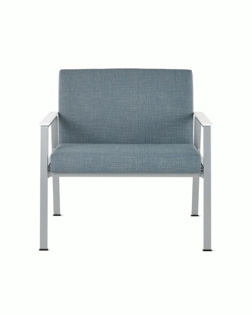 Blue upholstered armchair with silver metal arms and legs on a white background