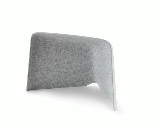 Dark blue modern chair with a curved shell and cutout leg detail on a white background