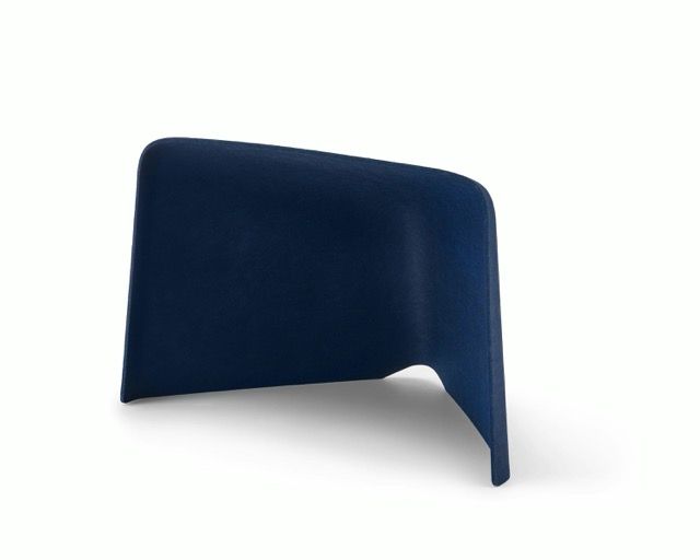 Dark blue modern chair with a curved shell and cutout leg detail on a white background