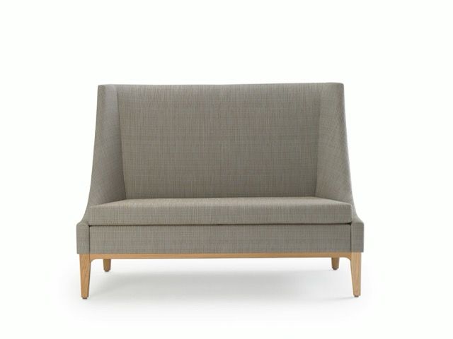 Gray upholstered loveseat with light wooden legs on a white background