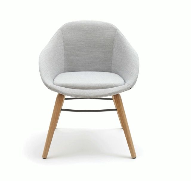 Gray upholstered accent chair with wooden legs and a white seat cushion on a white background