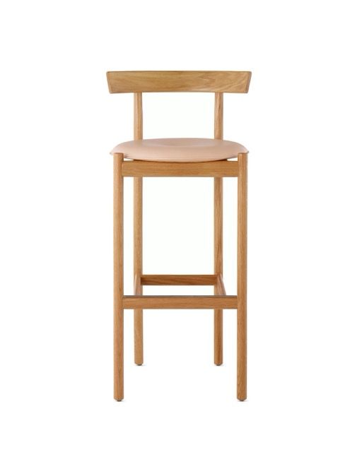 Light wood bar stool with a backrest and pale beige seat on a white background