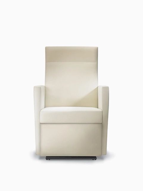 Cream upholstered armchair with high back and low arms on a white background