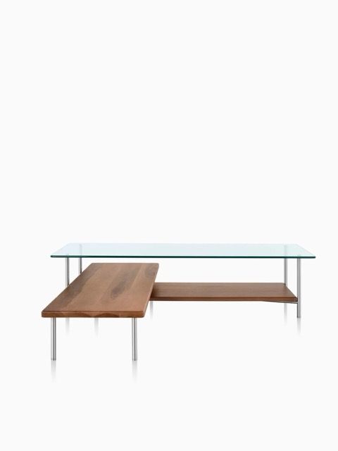 Modern glass coffee table with a wooden shelf and side extension, isolated on white background