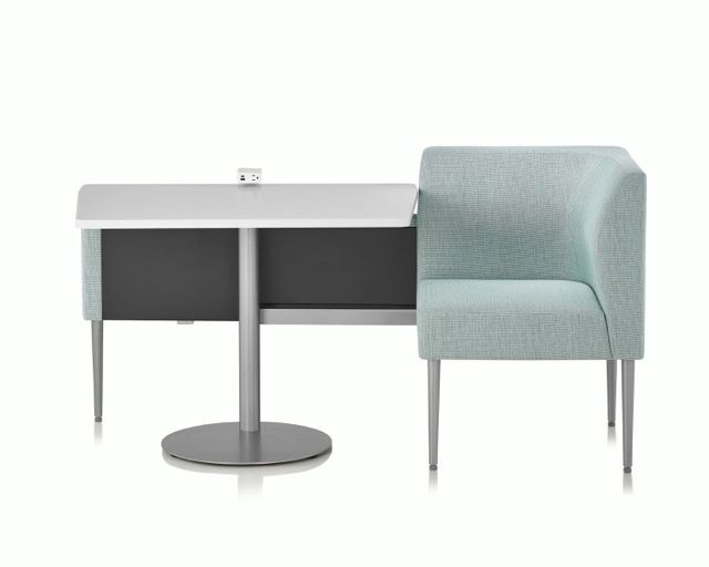 Modern desk with gray upholstered chair and round pedestal base, shown on a white background