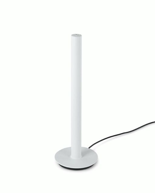 White cylindrical desk lamp with a round base and visible power cord on a plain background