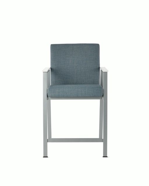 Gray upholstered chair with metal frame on a white background