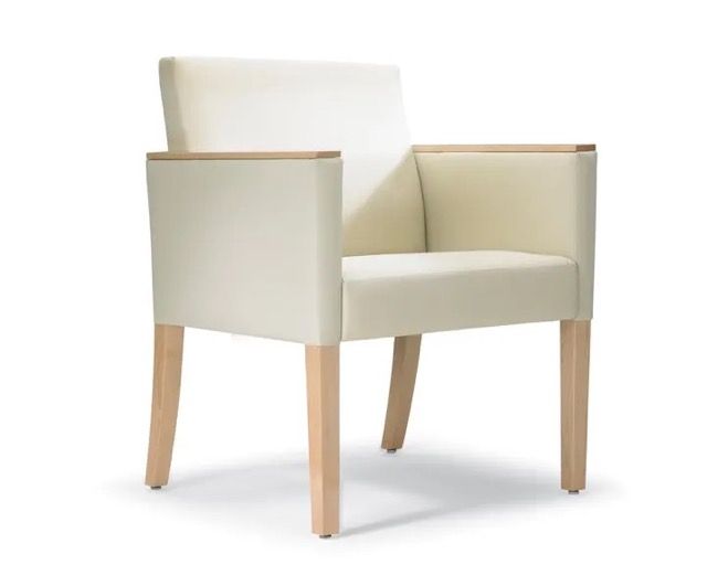 Modern cream upholstered armchair with light wood frame on a white background