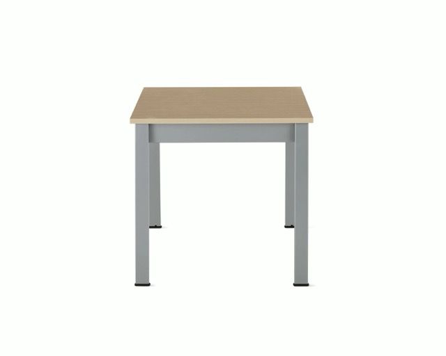 Small light wood table with gray metal legs on a white background
