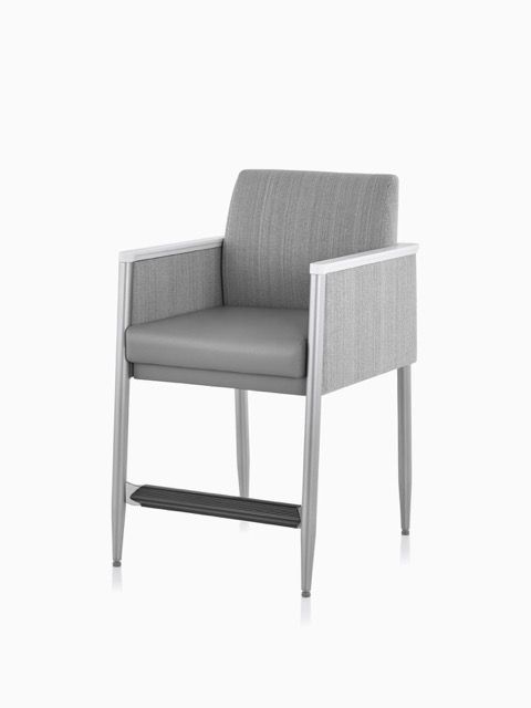 Gray upholstered bar stool with armrests and a metal frame on a white background