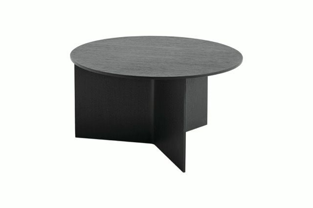 Black round table with a curved base on a white background