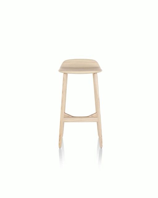 Light wood bar stool with a beige cushioned seat on a white background