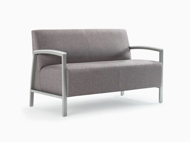 Gray upholstered loveseat with light metal arms on a white background