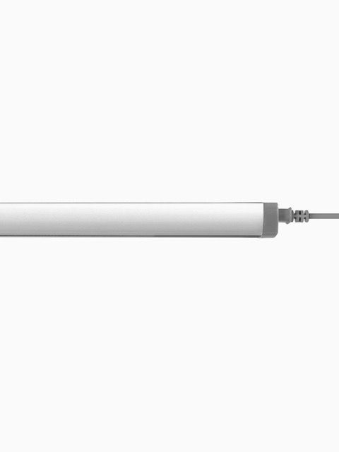Silver linear rod with tapered ends on a white background