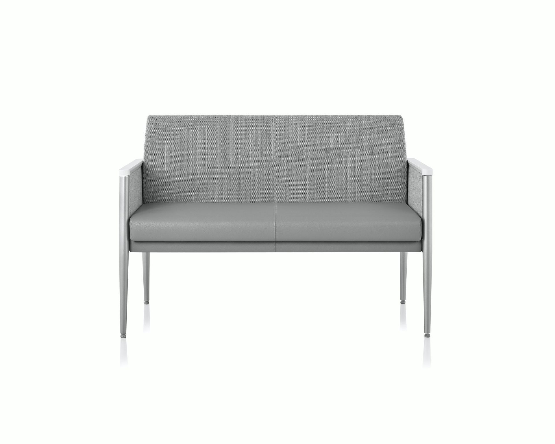 Gray upholstered two-seat sofa with metal legs on a white background