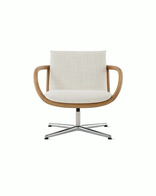 Modern beige upholstered armchair with wooden arms and chrome base, isolated on white background