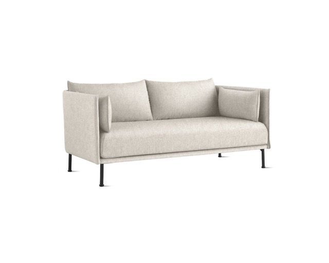 Light beige modern sofa with black metal legs on a white background