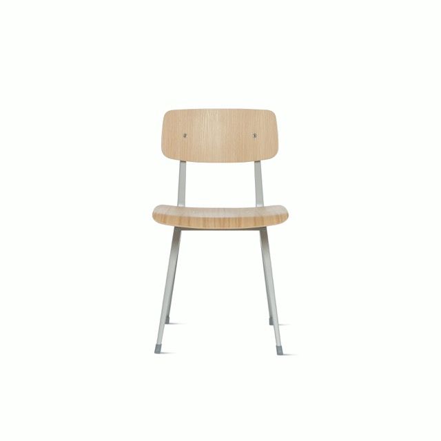 Minimalist wooden chair with metal legs on a white background