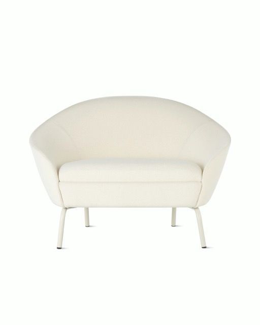 White upholstered loveseat with curved back and armrests on a plain white background.