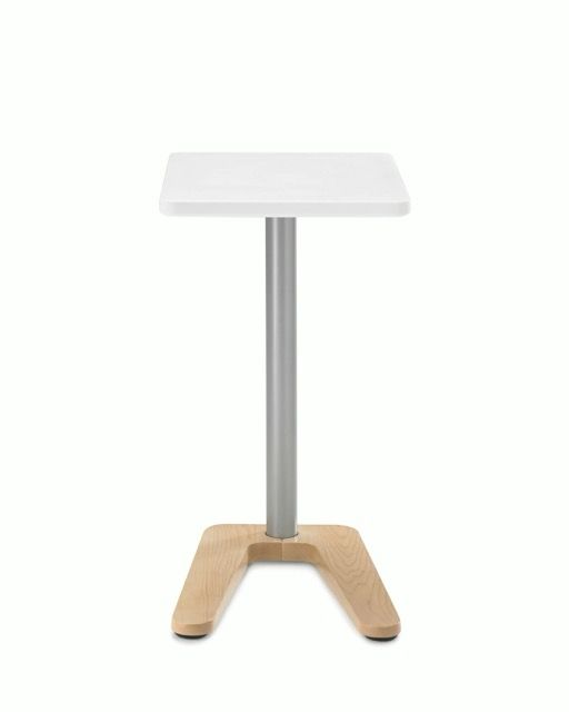 Compact standing desk with white top, metal pole, and light wood base