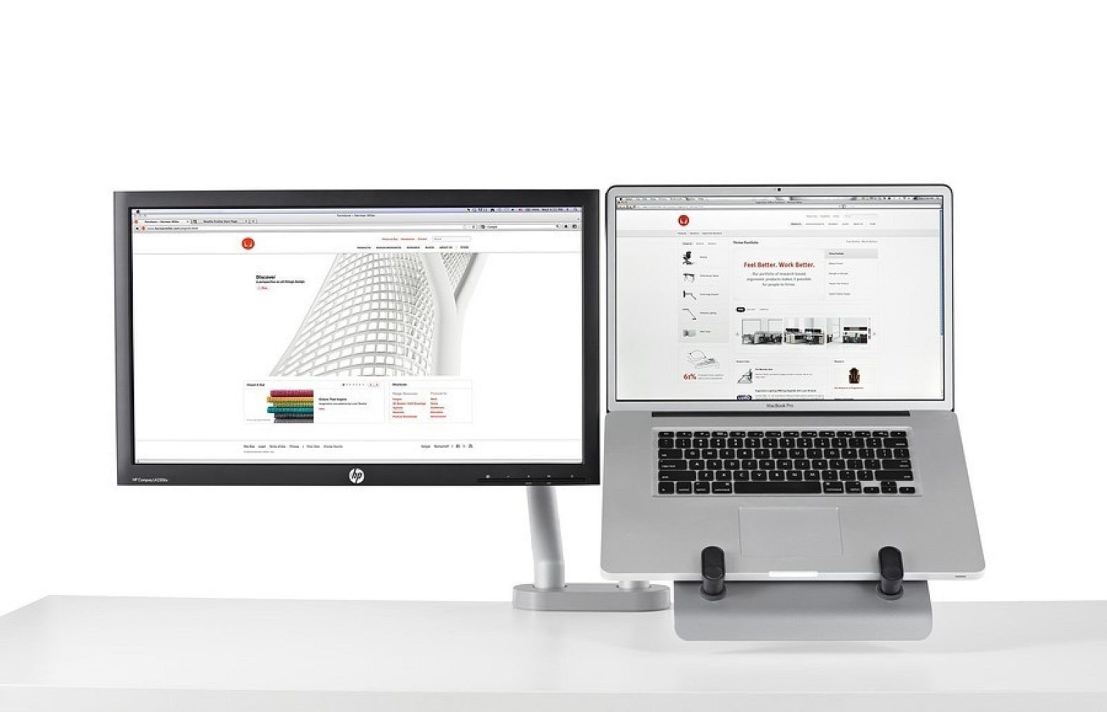 Adjustable silver laptop stand with an open laptop on a desk arm mount