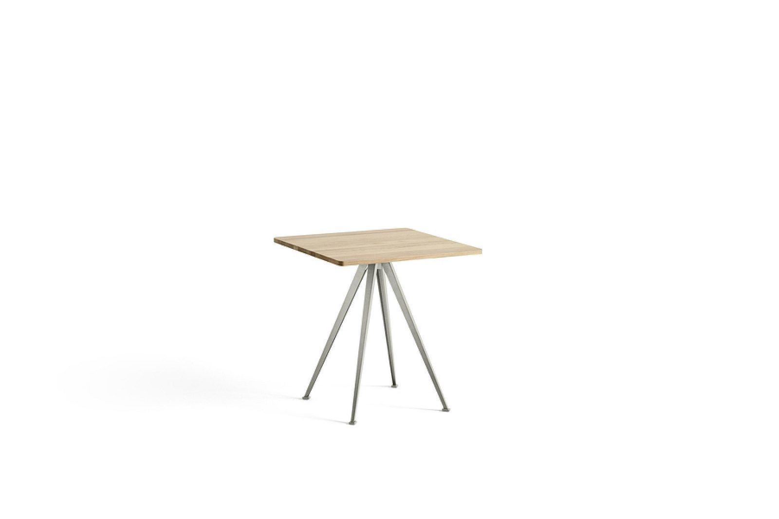 Round wooden table with black metal legs on a white background