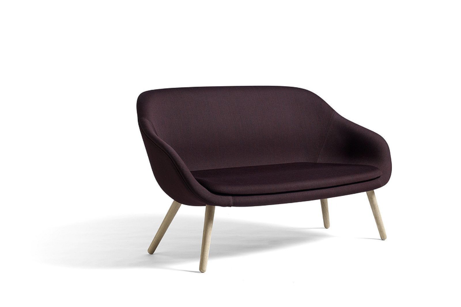 Light gray upholstered lounge chair with wooden legs on a white background