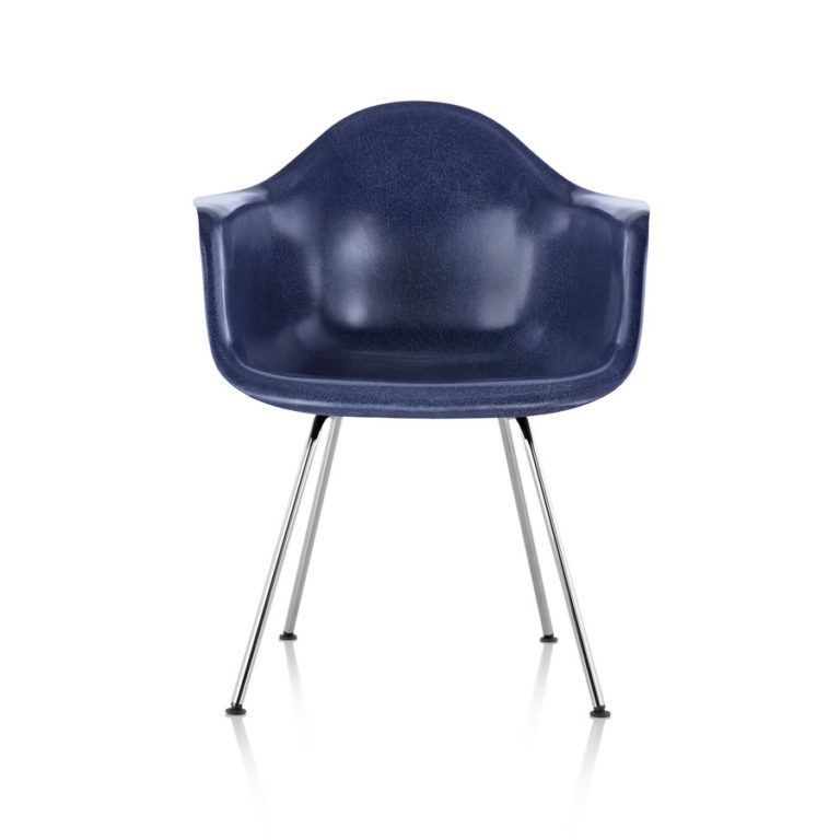 Blue upholstered chair with chrome legs on a white background