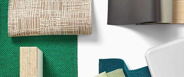 Assorted fabric and material samples in beige, green, gray, teal, and white on a white background